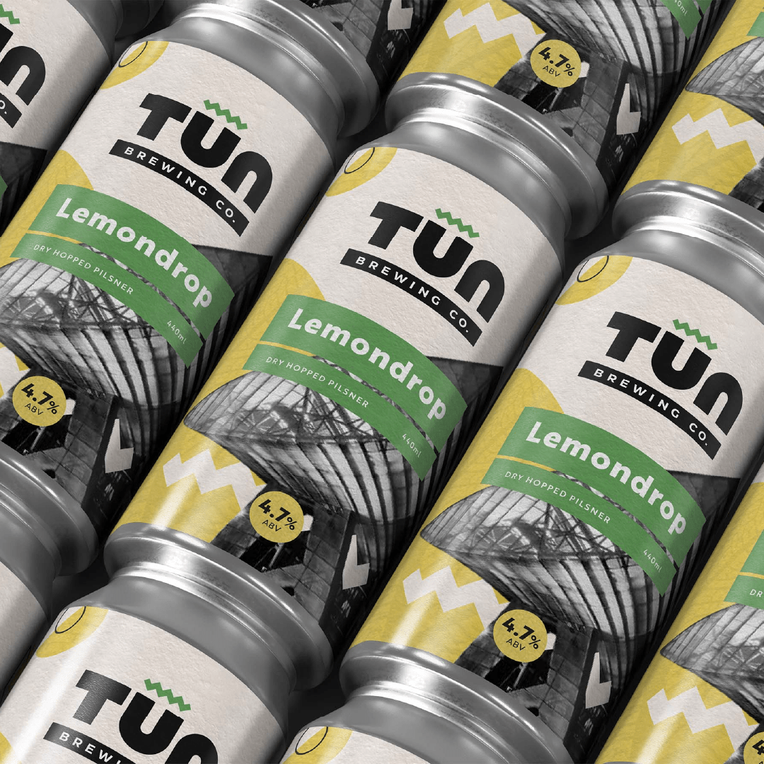 A close-up collection of Lemondrop cans showing the label design